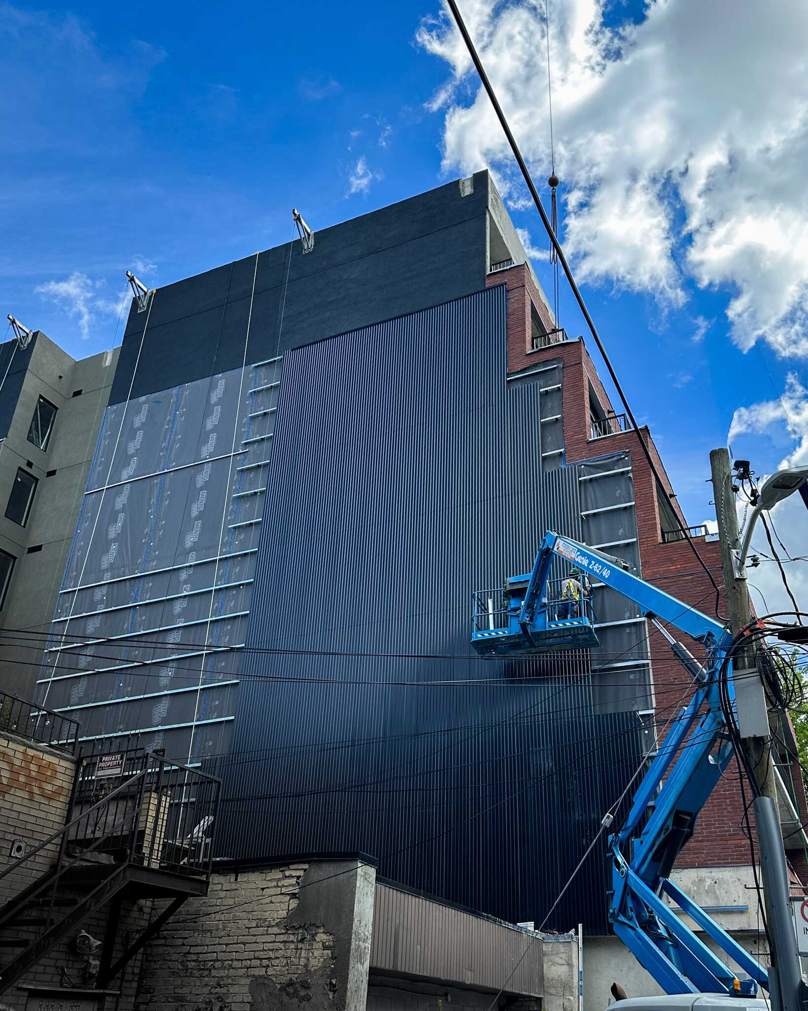CLADDERS-by-modernizer-high-rise-metal-siding-corrugated-steel-cladding-Toronto-ON-CANADA-001
